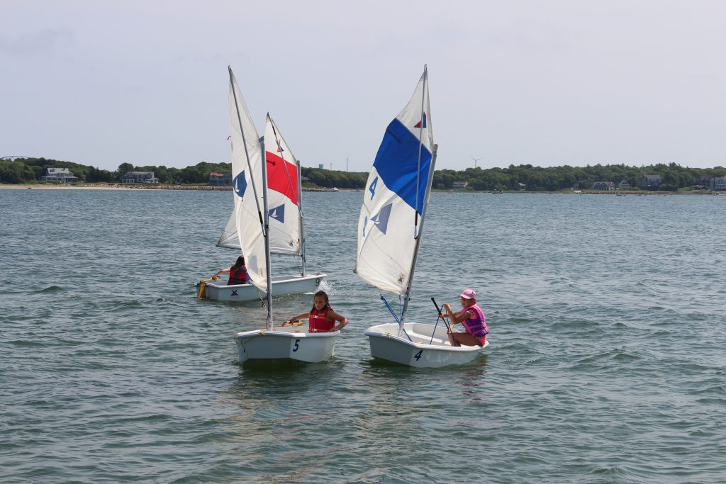 students sail towards the camera