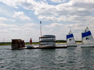 Instructor and students on the float with prams