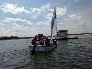 four kids in an overloaded pram